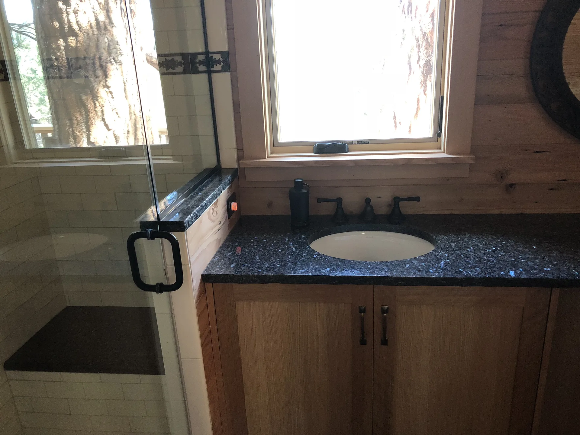 Blue Pearl granite bathroom vanity with wood cabinetry