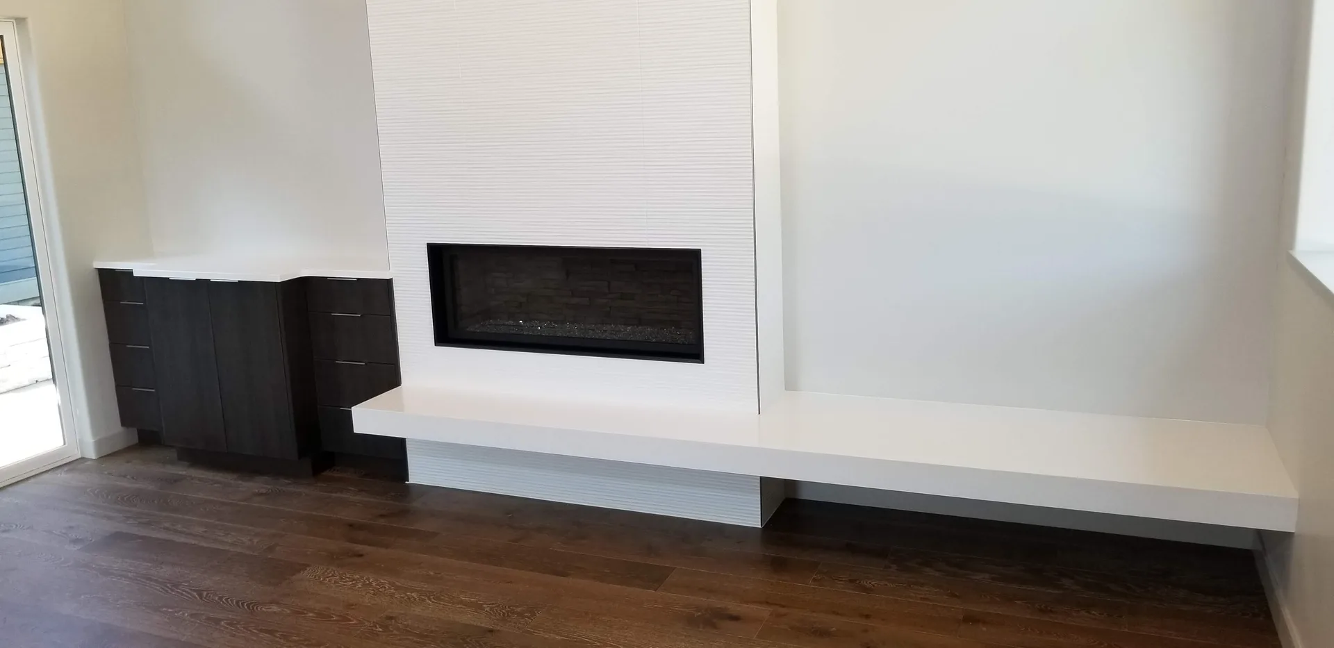 Modern white quartz linear fireplace hearth and bench