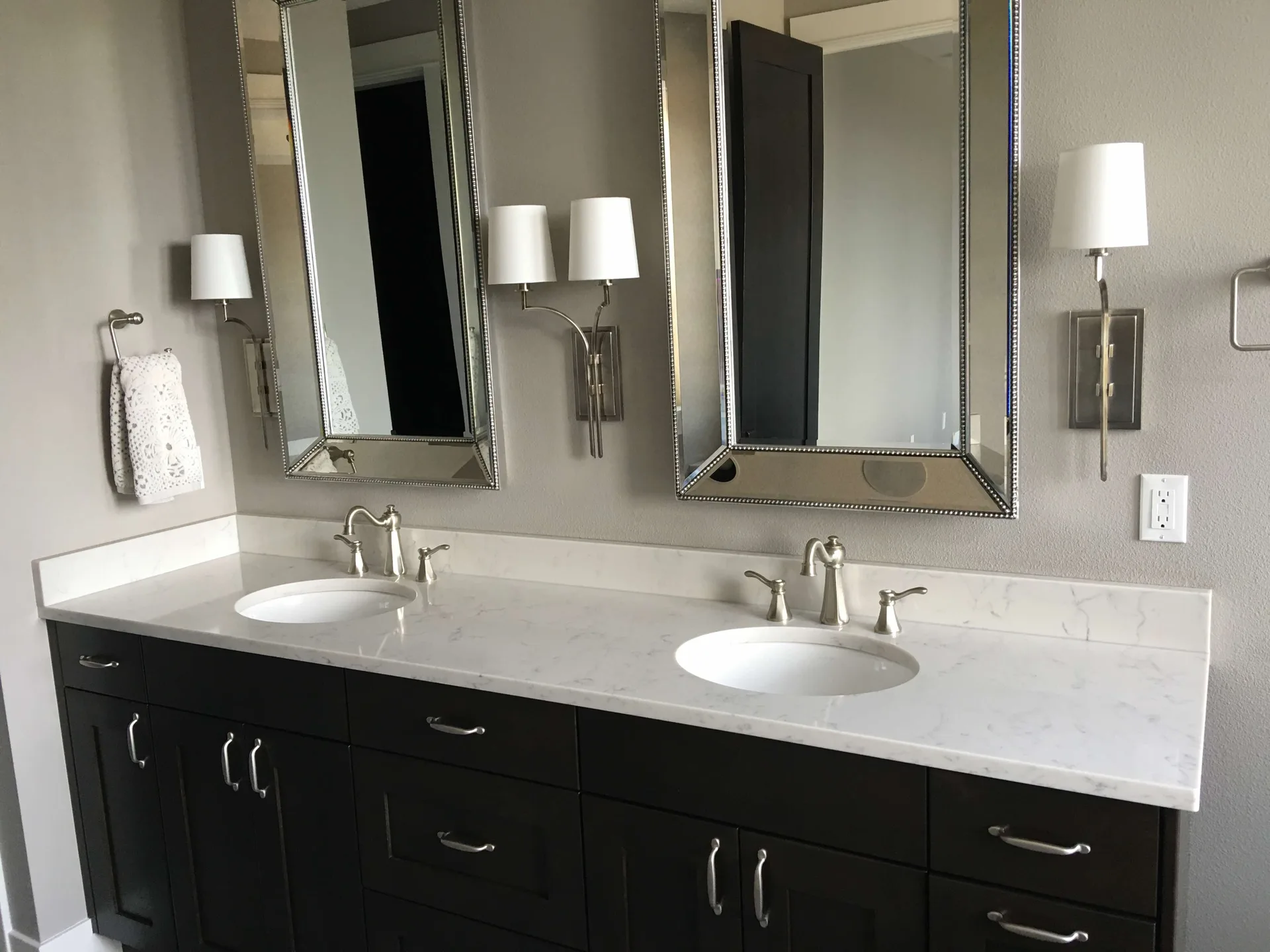 White quartz double vanity with espresso cabinets