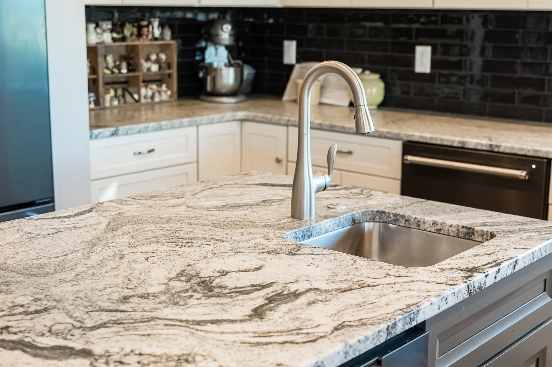 Granite kitchen island with stainless undermount sink