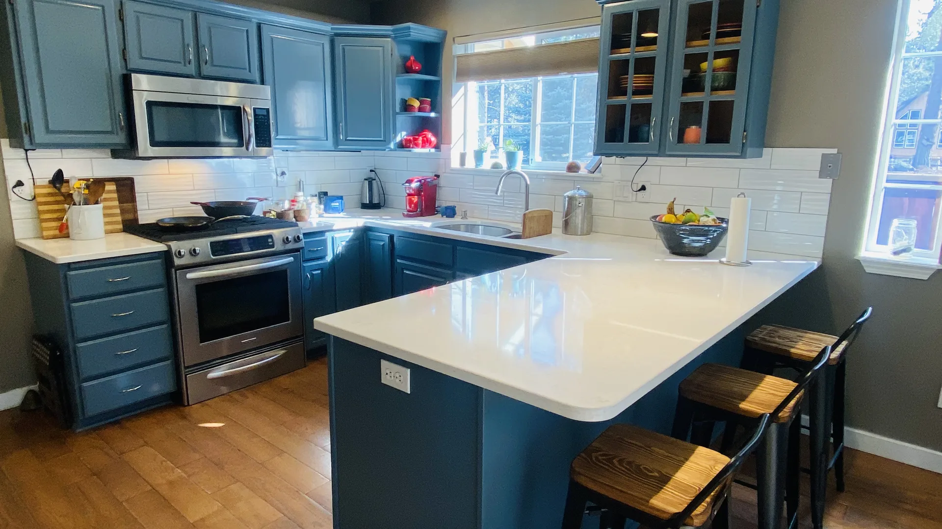White quartz countertops with blue cabinet kitchen