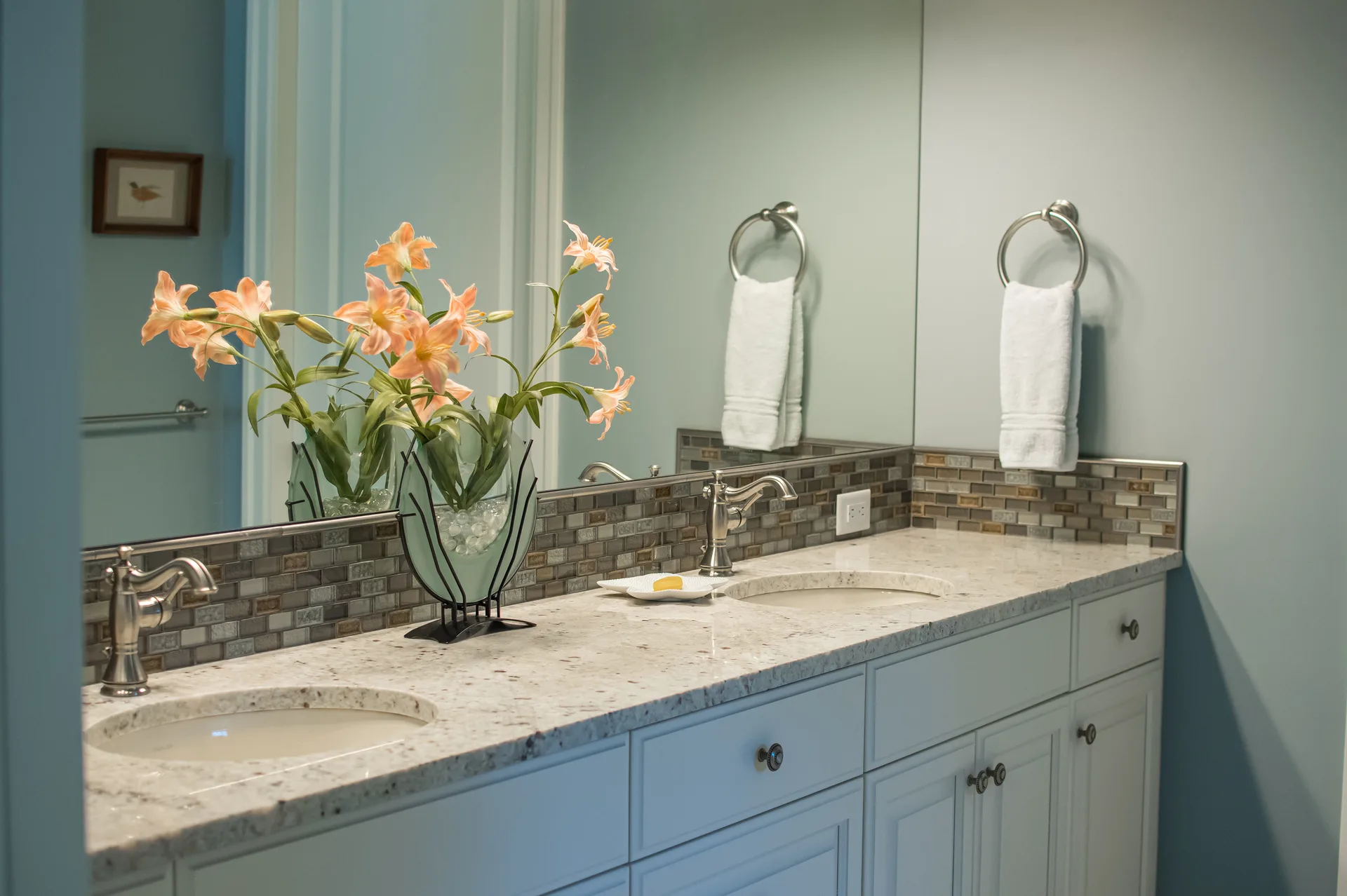 Light granite double vanity bathroom with tile backsplash