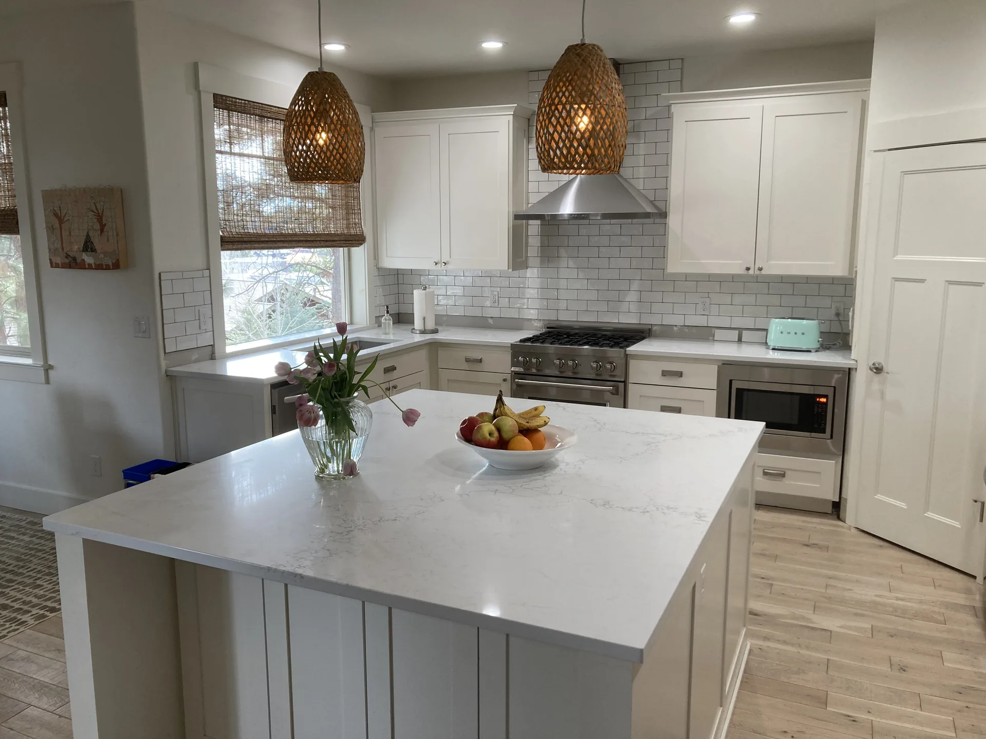 White quartz kitchen island with Carrara-style veining