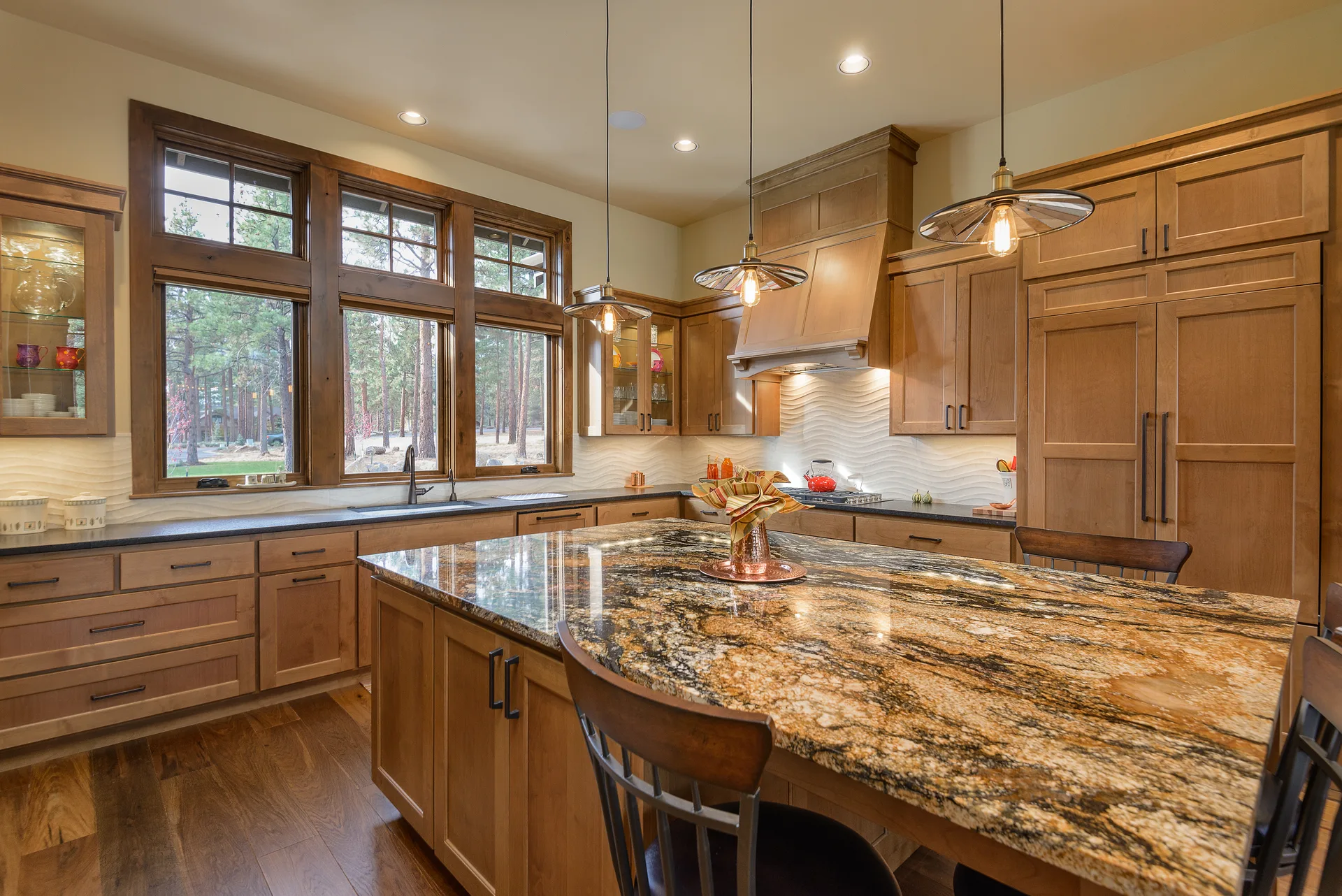 Gold and brown exotic granite island in rustic wood kitchen