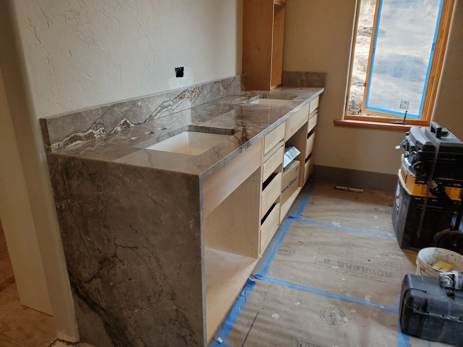 Gray marble waterfall-edge bathroom vanity
