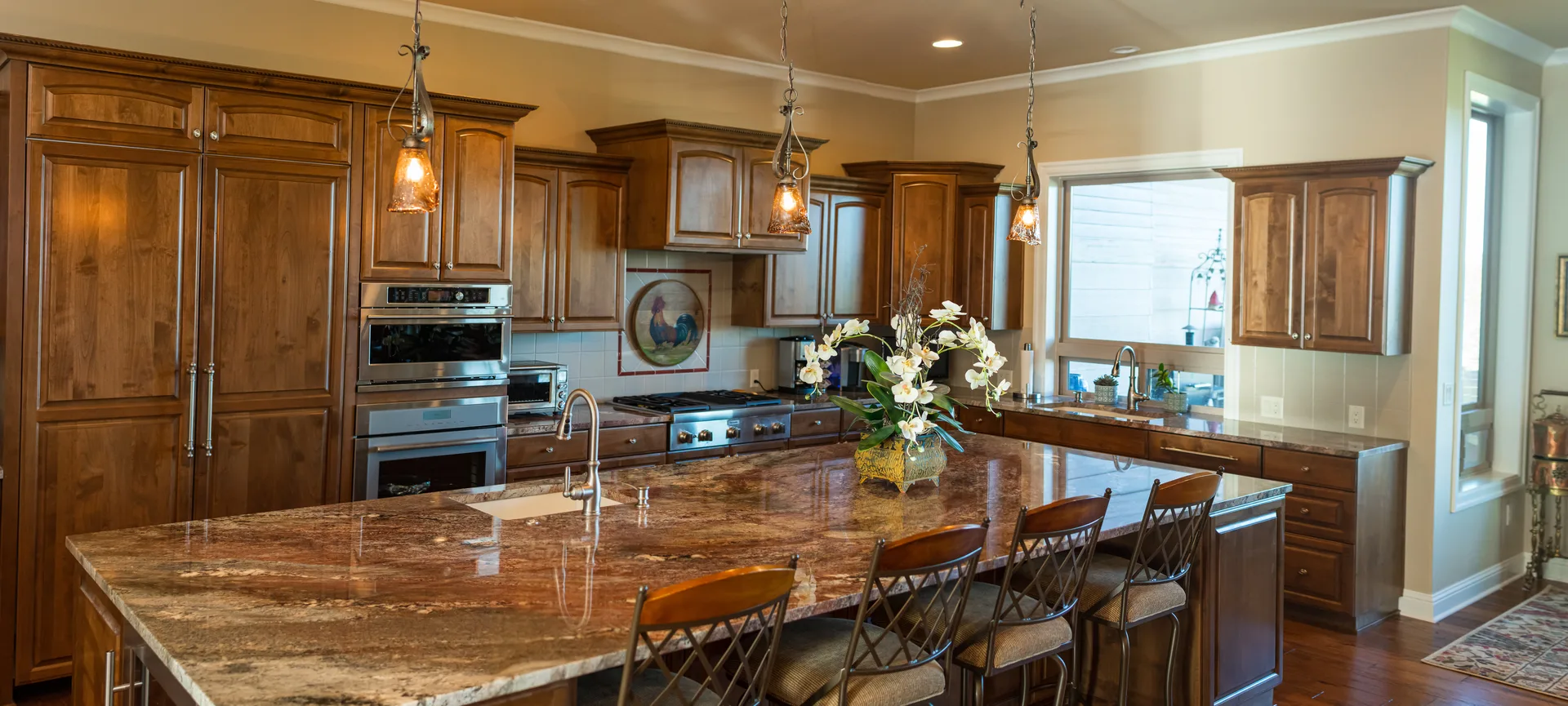 Gold granite island in knotty alder kitchen