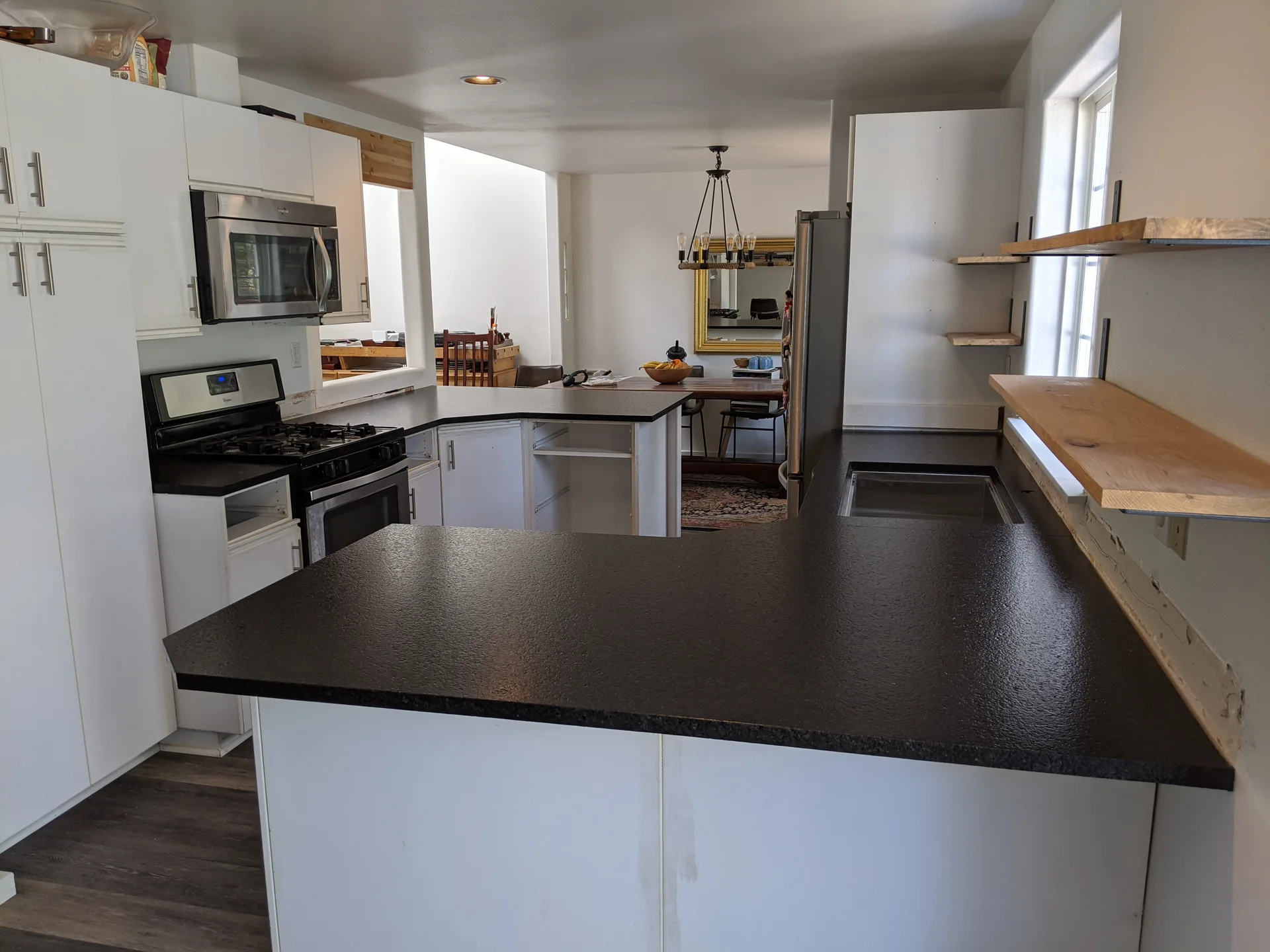 Espresso brown granite kitchen peninsula